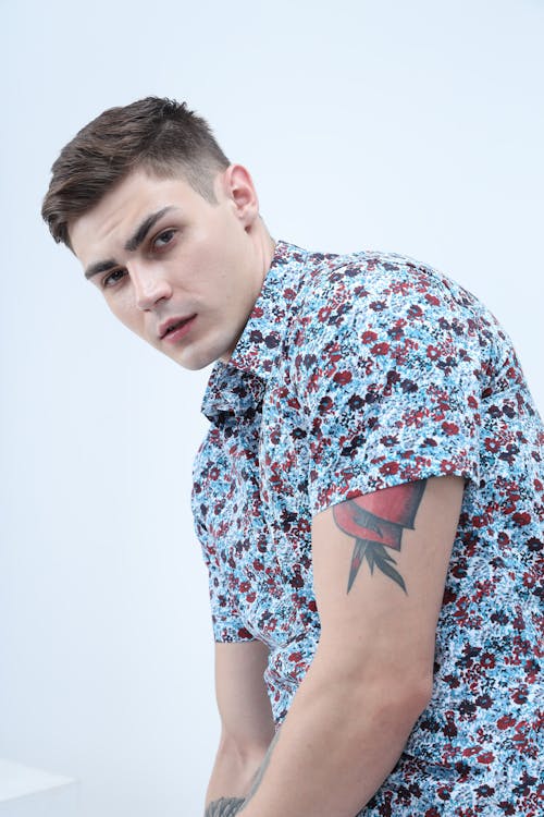 Handsome Man in a Floral Shirt Looking at the Camera