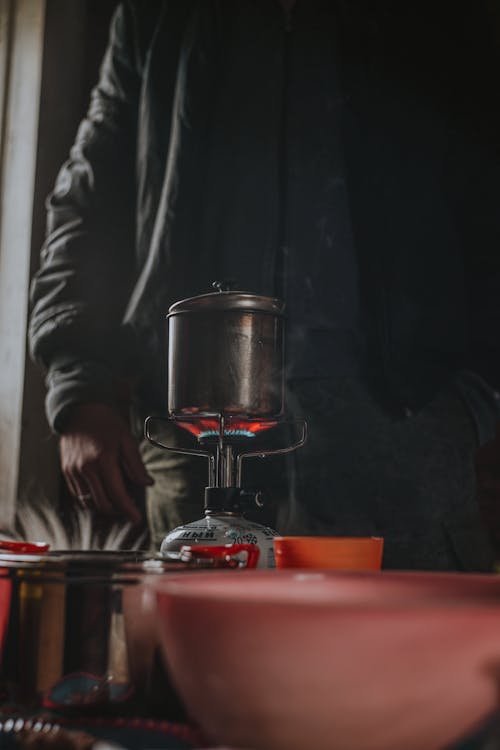 Man Cooking on an Outdoor Gas Burner 