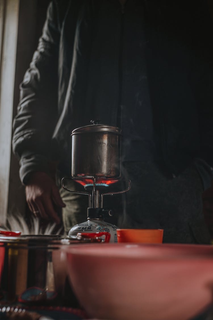 Man Cooking On An Outdoor Gas Burner 