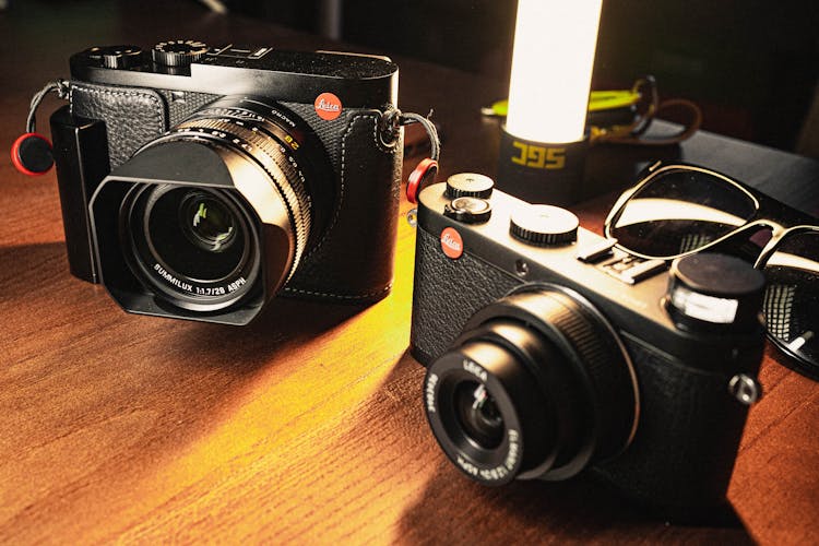 Leica Cameras On A Wooden Table