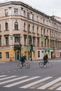 People Crossing the Road with their Bicycles