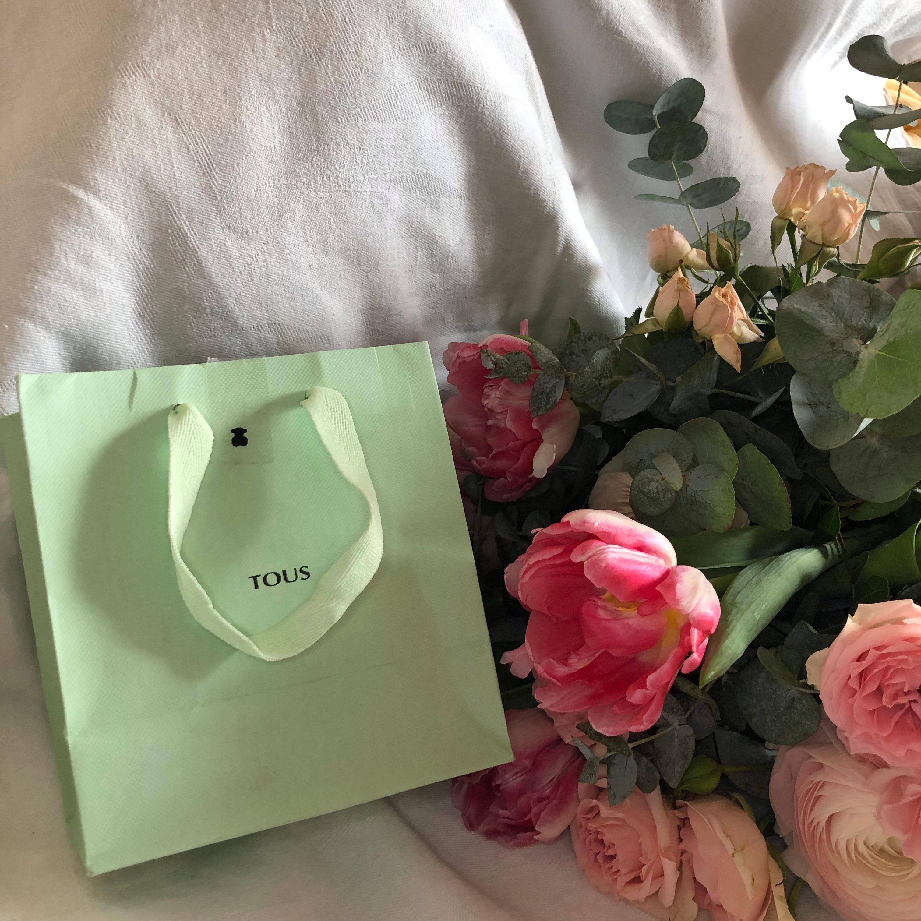 Pink Peonies Beside a Green Paper Bag