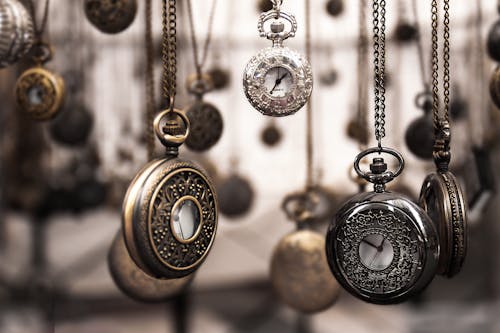 Assorted Silver-colored Pocket Watch Lot Selective Focus Photo