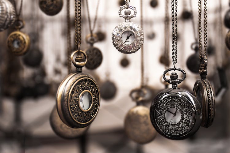 Assorted Silver-colored Pocket Watch Lot Selective Focus Photo