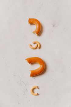 Minimalist top view of crunchy sushki cookies on a white surface, perfect for dessert-themed projects.
