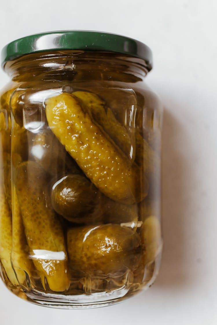 Close-up Photo Of Pickles On A Glass Jar