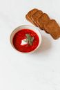 Red Liquid in White Ceramic Bowl