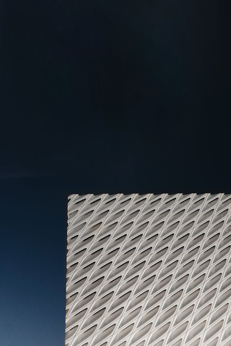 Modern Geometric Building Design Against Blue Sky