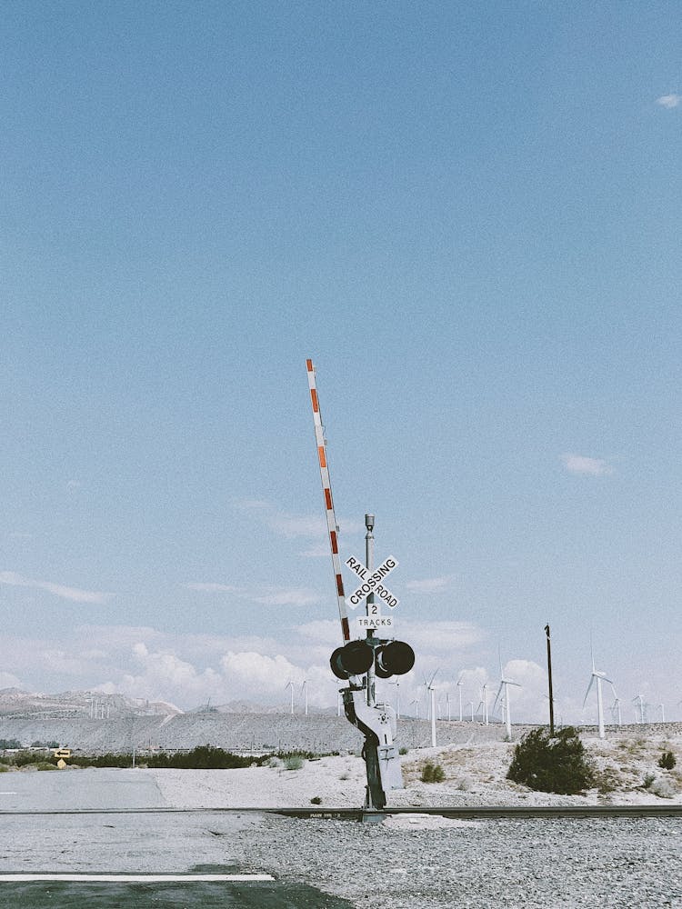 Railway Crossing And Wind Turbines