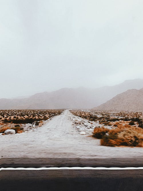 Blurry Unpaved Road Covered in Snow 