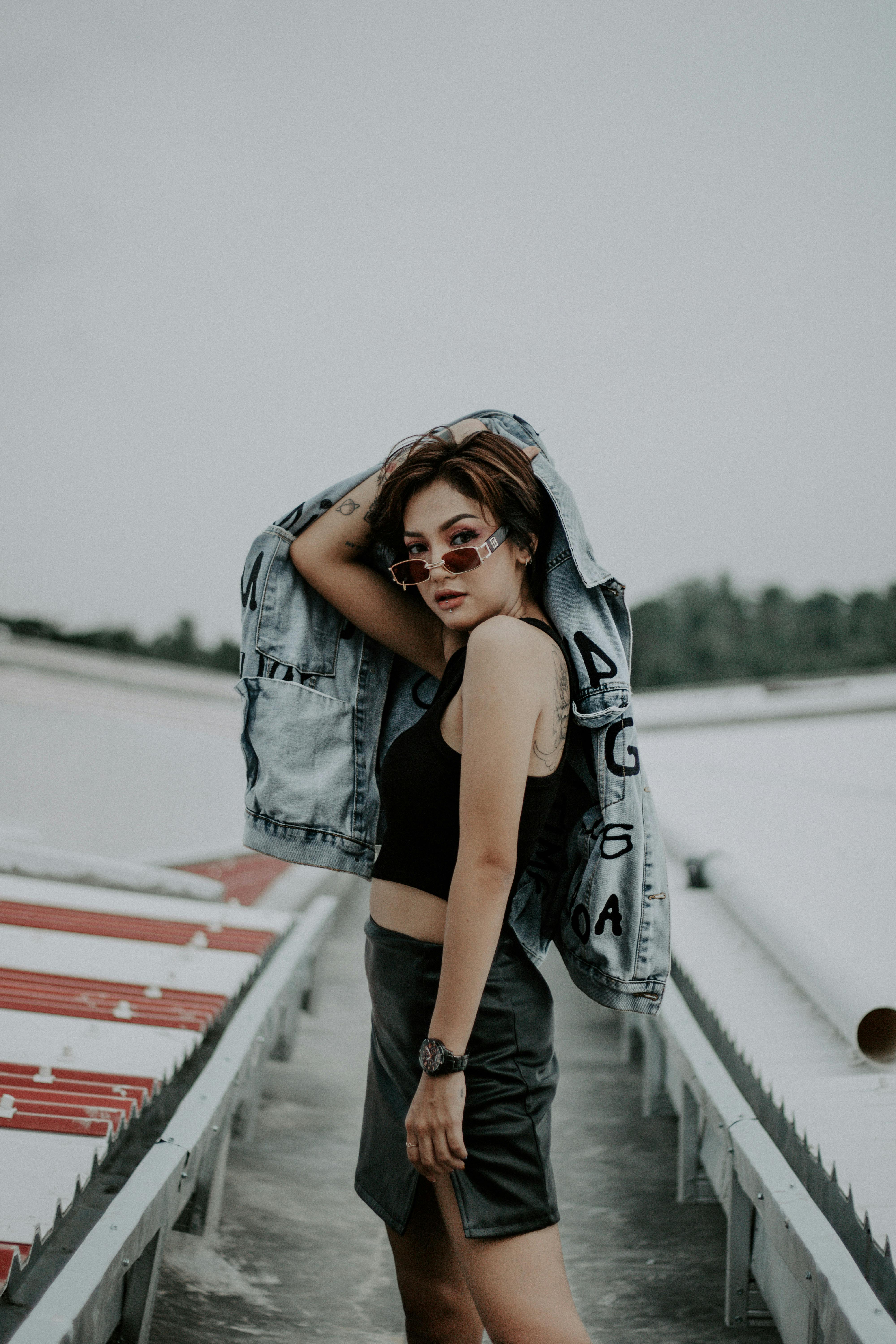 Beautiful young model with impudent look in jeans shorts Stock Photo |  Adobe Stock