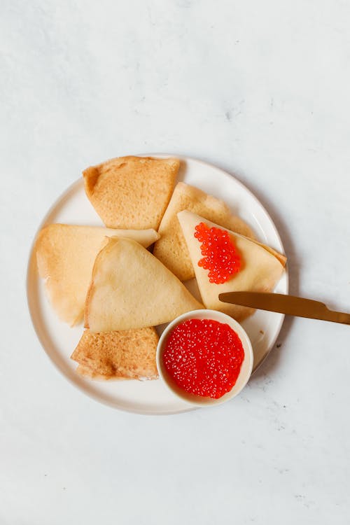 Free Crepes with Red Caviar on Top Stock Photo
