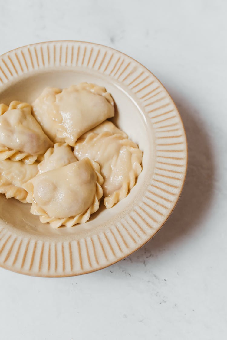 Cooked Pierogi On Ceramic Plate