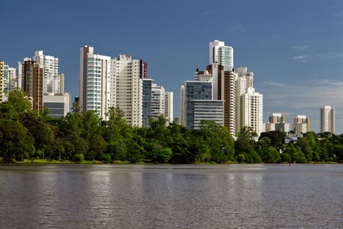 Free Stunning view of modern skyscrapers and lush greenery along Igapó Lake in Londrina, Brazil. Stock Photo