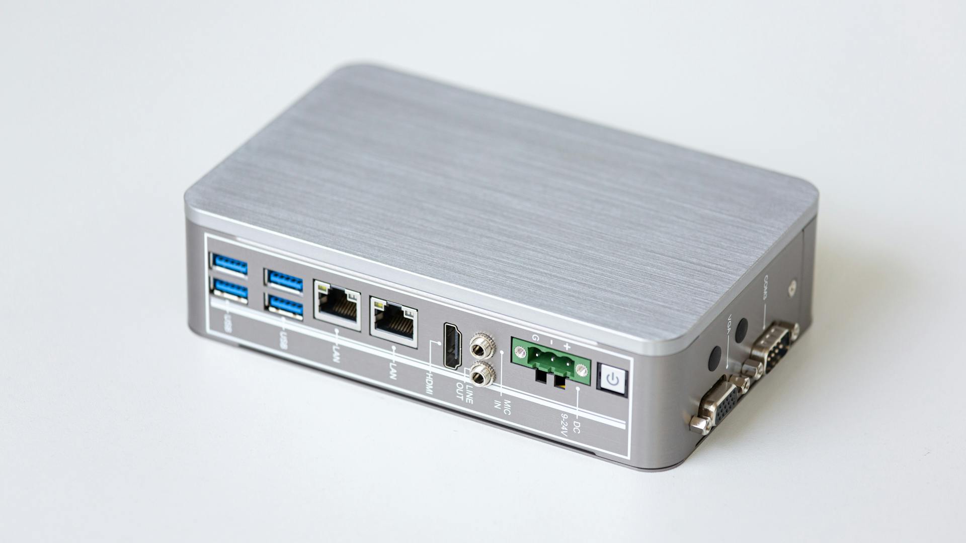 A silver network router with multiple USB ports, perfect for small offices.