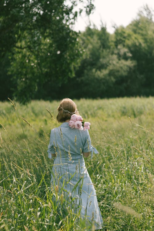 A Woman in a Grass Field 
