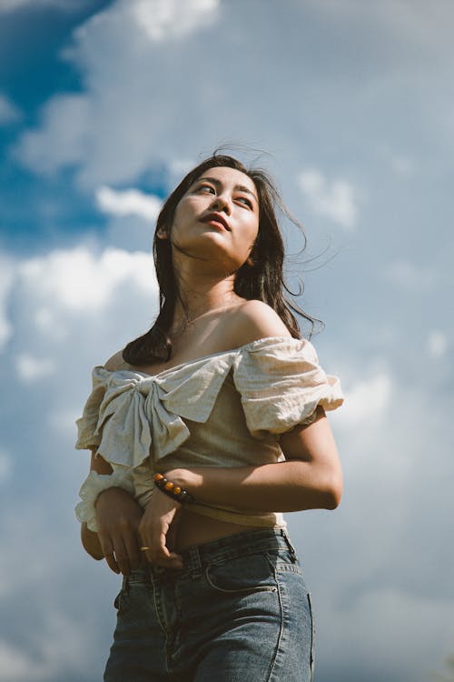 Close-Up Shot of a Woman Wearing an off Shoulder Top