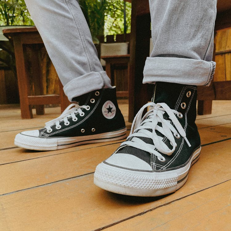 Feet in Sneakers with White Shoelaces · Free Stock Photo