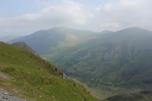 Free Breathtaking scenic view of Snowdonia mountains in Wales under a cloudy sky. Stock Photo