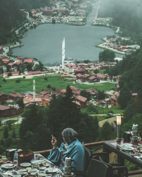 A picturesque view of Uzungöl Lake and surrounding village from a balcony in Trabzon, Turkey.
