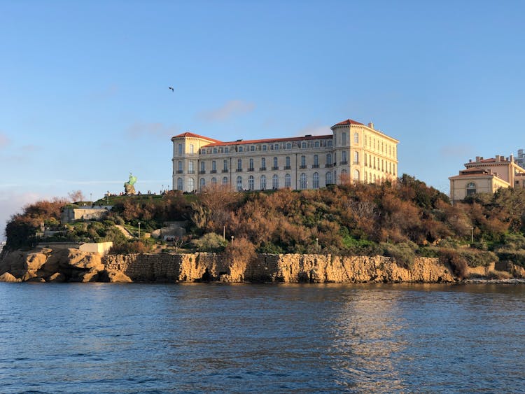 Palais Du Pharo Near Body Of Water