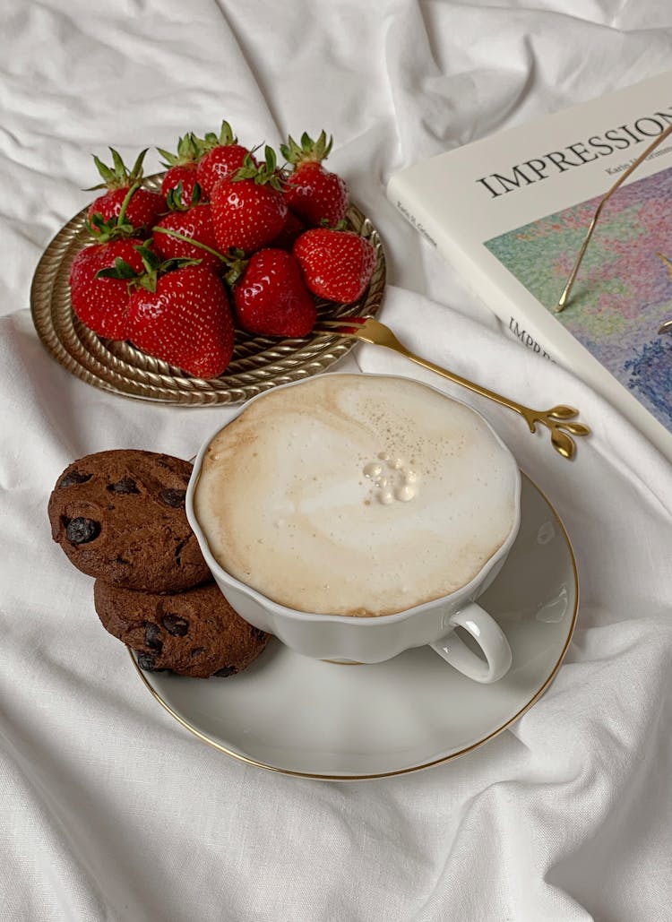 A Cup Of Cappuccino And Cookies