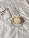 Reading Glasses on Top of an Open Book