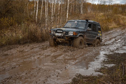 Free Land Rover Driving on the Mud Stock Photo