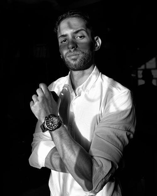 Black and White Photo of a Man Wearing a Watch