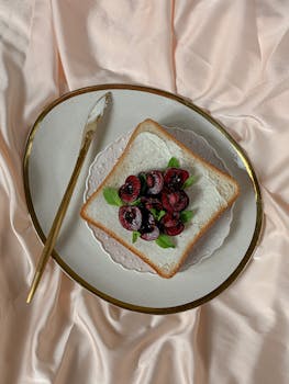 A luxurious presentation of cherry toast on a satin surface, exuding elegance and taste.