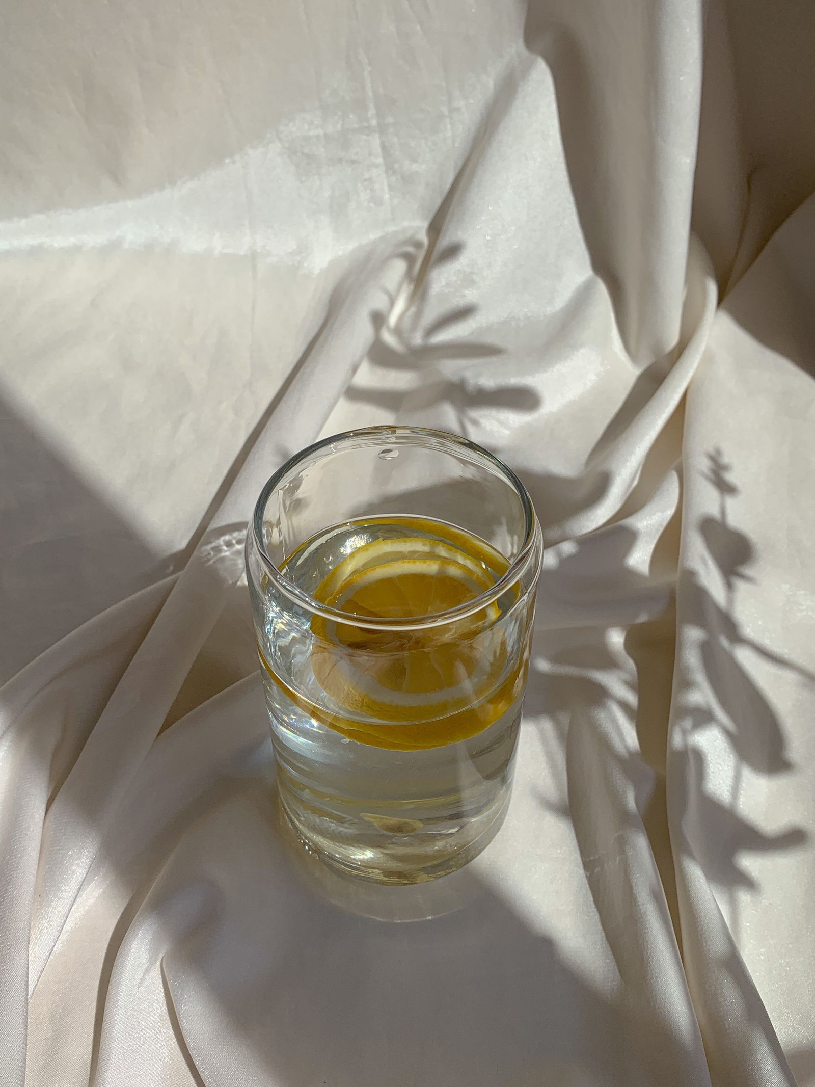 Lemon infused water in clear glassware