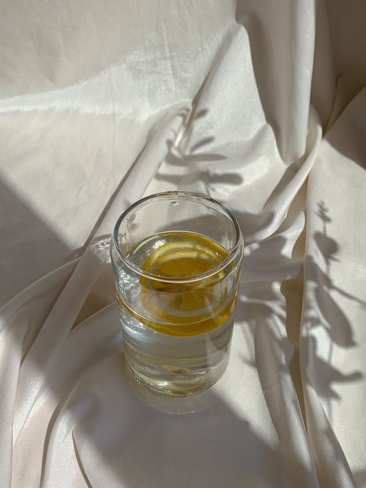 Clear Drinking Glass With Lemon In Water