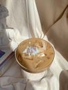 Pouring Milk on Iced Coffee
