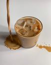 Pouring Coffee on White Surface