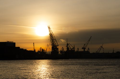 Photos gratuites de chantier naval, coucher de soleil, eau