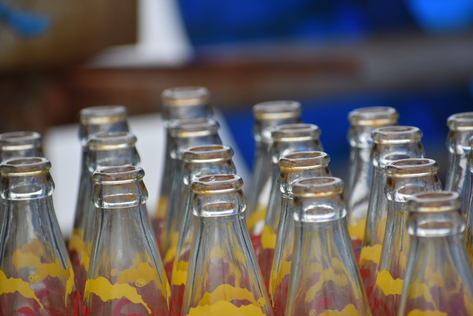 Collection of plastic and glass bottles with Pfand labels in Germany