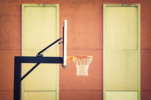 Stylish indoor basketball hoop with net against a modern wall background.
