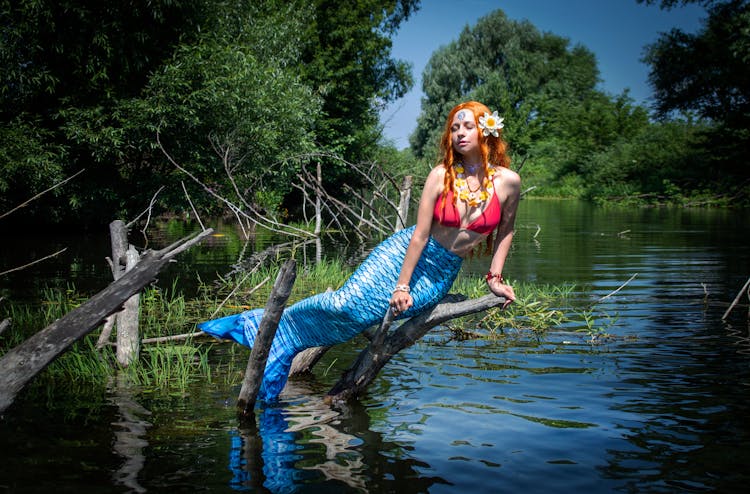 Woman In Mermaid Costume Posing 