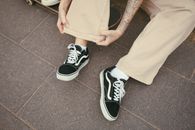 Person in Beige Pants Wearing Sneakers