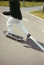 A Person in Black Long Sleeve Shirt Riding Black Skateboard