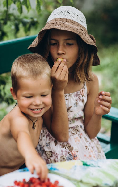 Siblings Eating Together