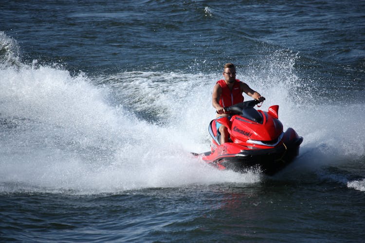 Man Riding A Jetski In A Sea 