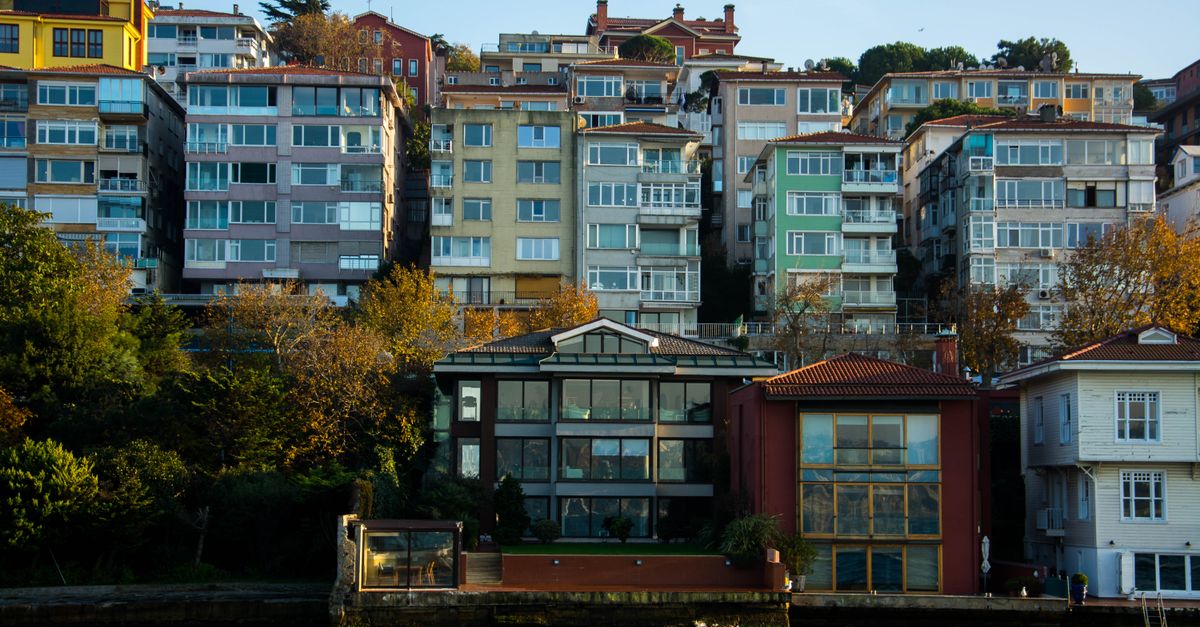 Colorful waterfront buildings with classic architecture in urban setting.