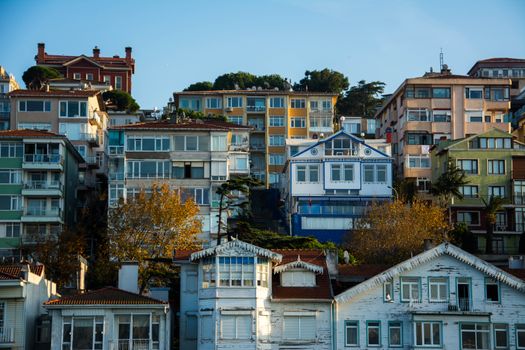 Urban scene featuring diverse architecture with colorful apartment buildings under a blue sky.