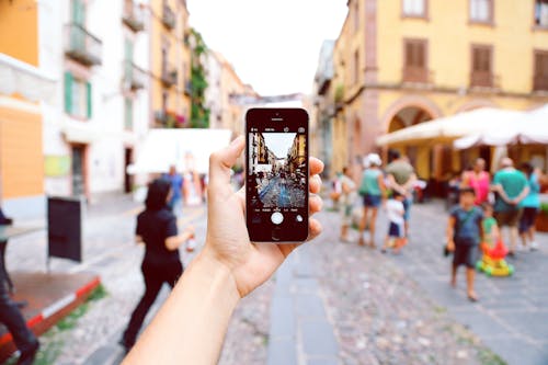 Person Holding Space Gray Iphone 5s