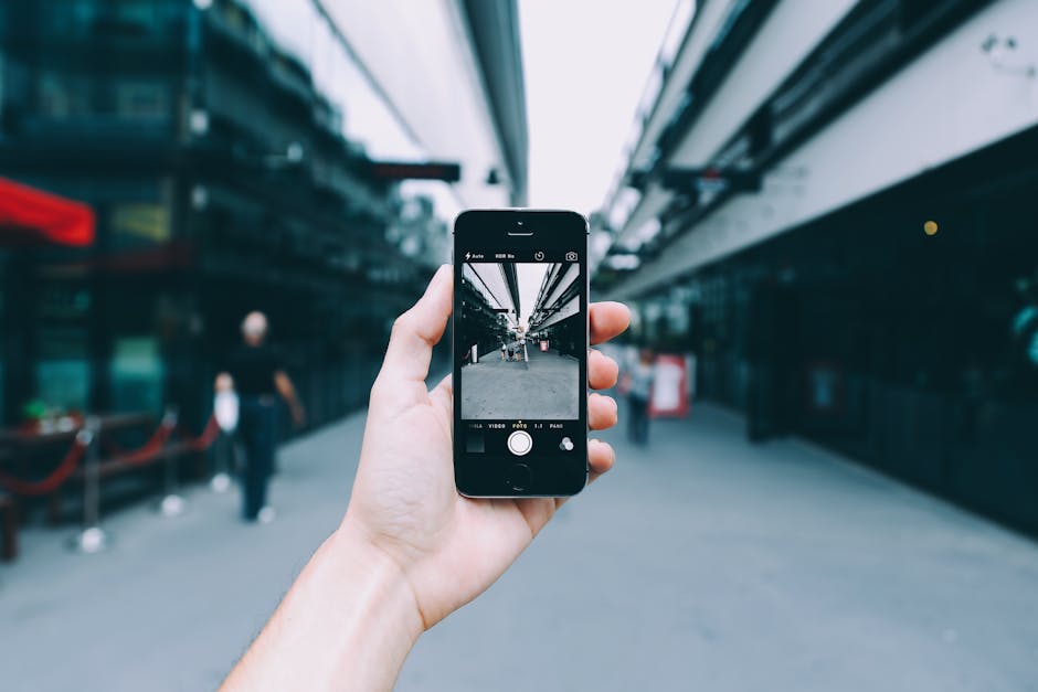 Person Holding Space Gray Iphone 5s