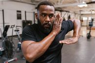 Man in Black Crew Neck T-shirt Covering His Face