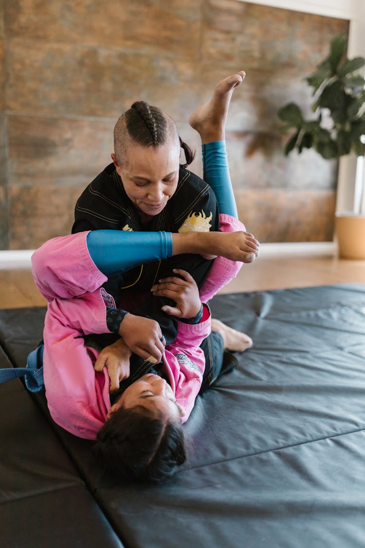 A Pair Of Taekwondo Athletes Sparring