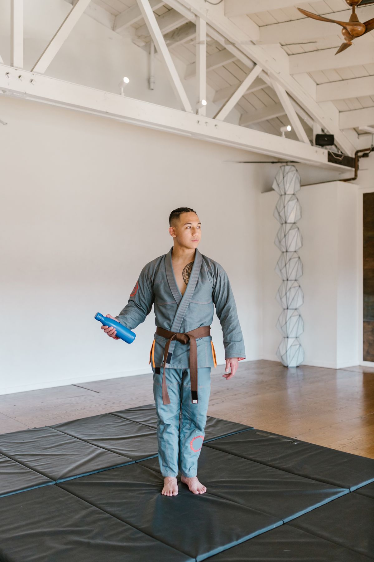Man wearing a traditional kung fu robe standing in pose