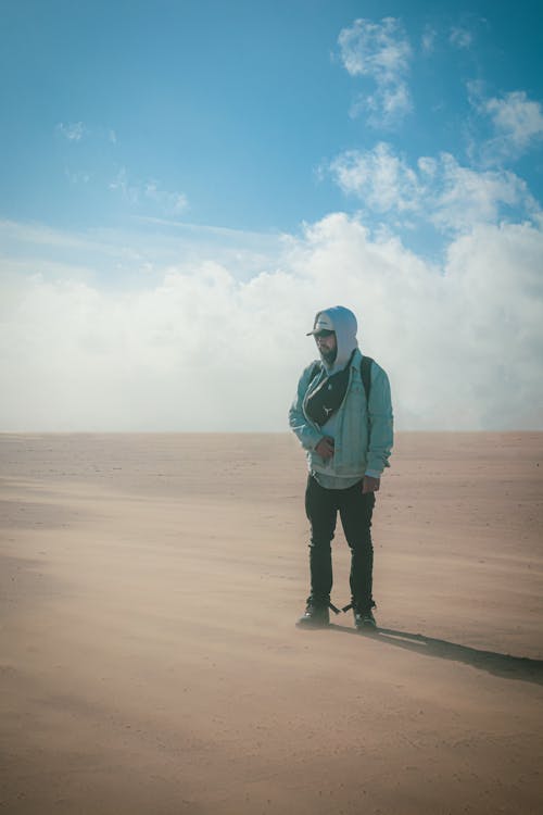 A Man Standing in a Desert Landscape 